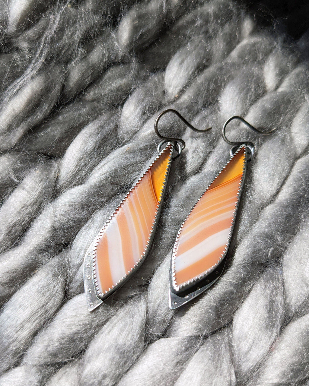 Hand-textured rivet detail on oxidized silver leaf earrings