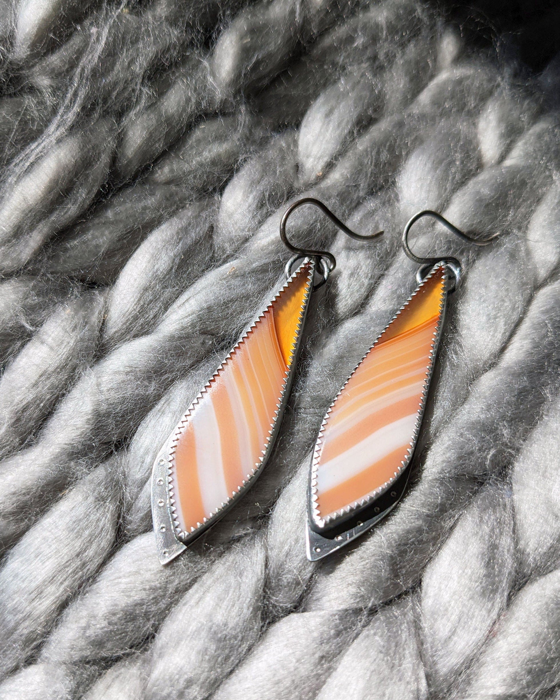 Hand-textured rivet detail on oxidized silver leaf earrings