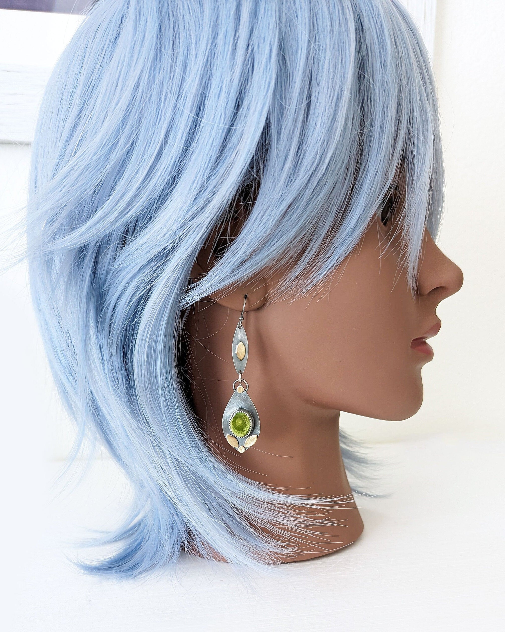 Nature-inspired turquoise earrings with symbolic olive green tones