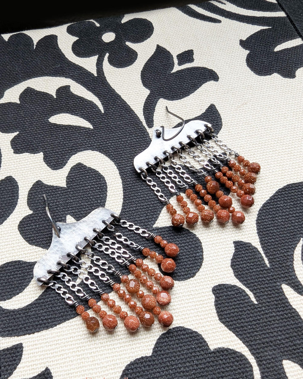 Orange goldstone earrings with hammered oxidized sterling silver and bead drops
