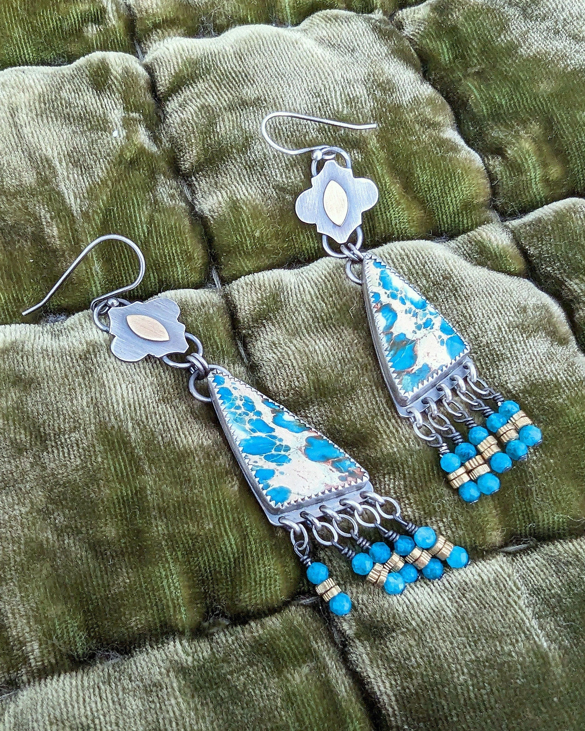 Asymmetrical artisan earrings with ocean-inspired color palette