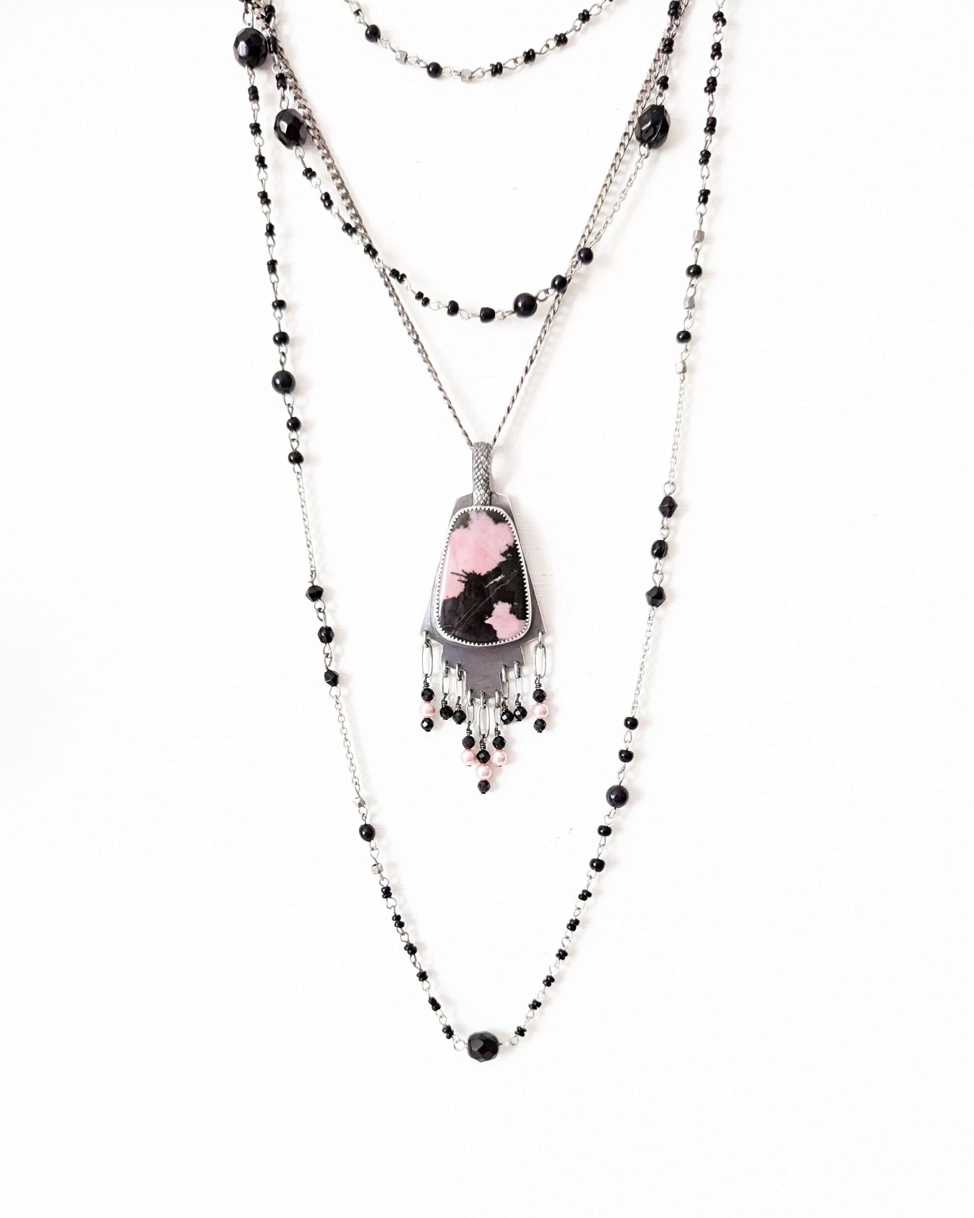 Black tourmaline and glass pearl fringe beneath rhodonite gemstone shown on chain with layering necklace (not included)