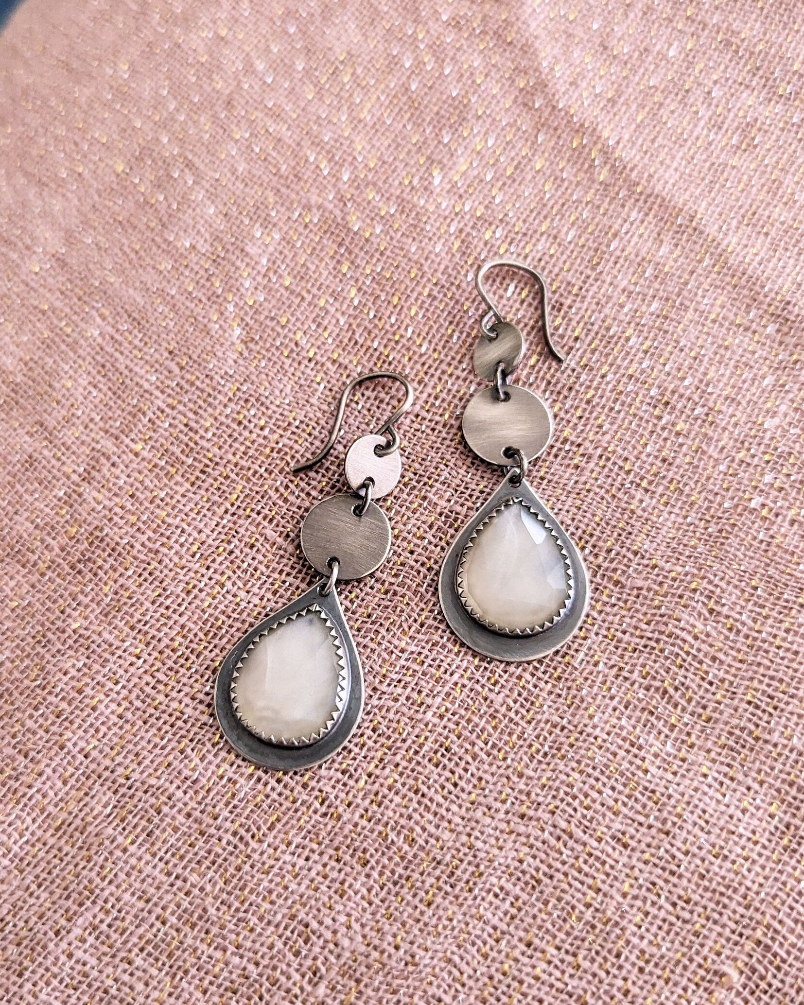 Neutral gemstone earrings with understated shimmer