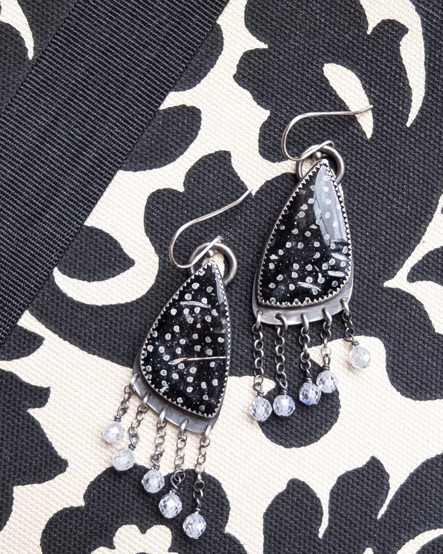 Palm root agate earrings in oxidized sterling silver with asymmetrical CZ bead fringe on fabric background
