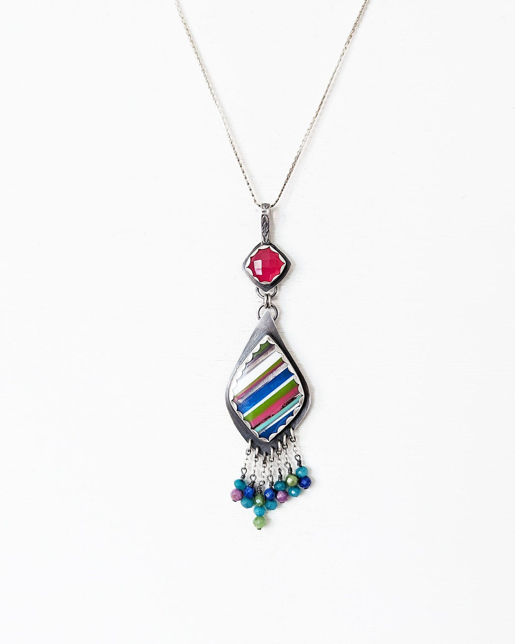 Recycled surfite artisan statement pendant shown on chain (not included)