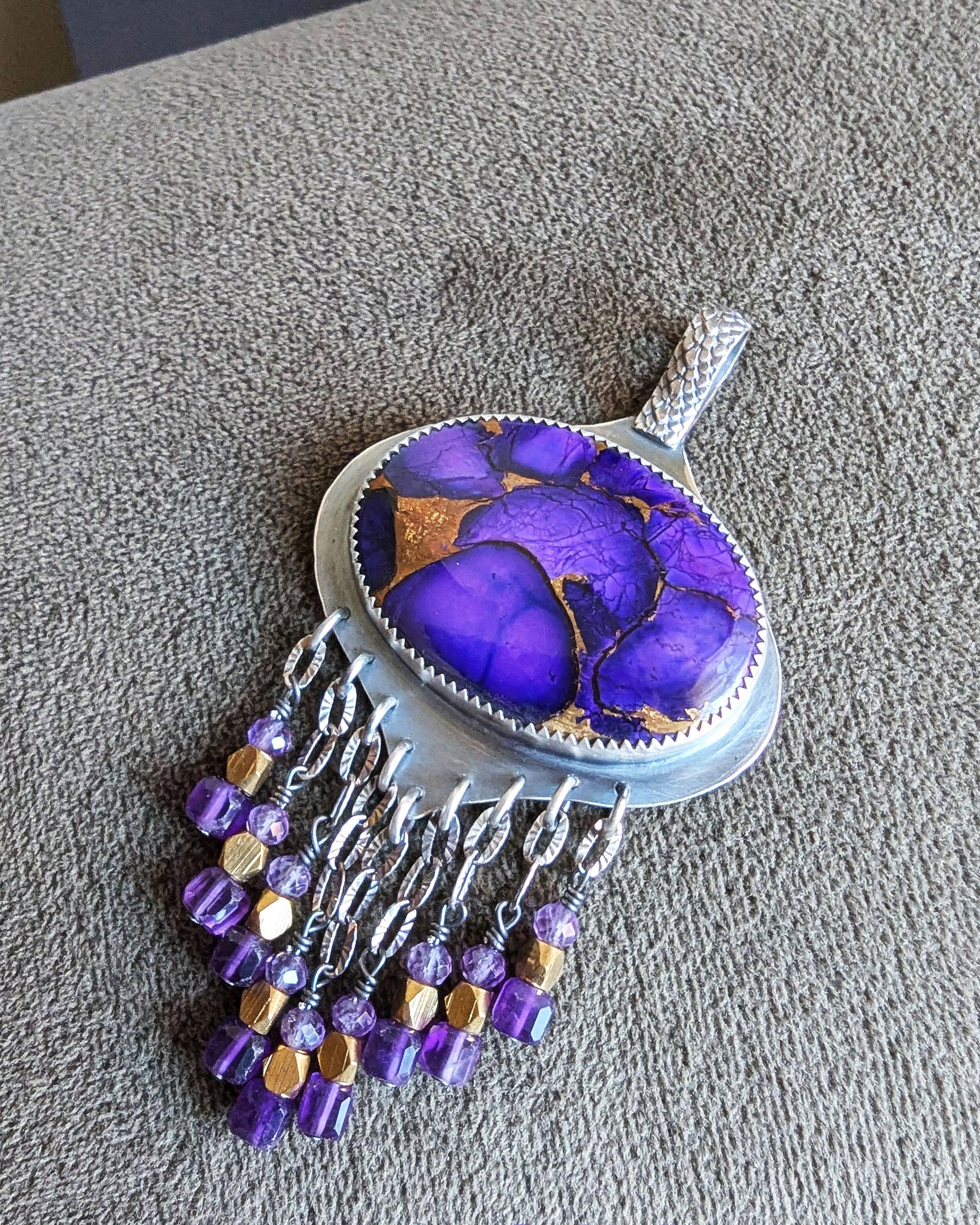 Amethyst and brass bead fringe beneath purple turquoise centerpiece
