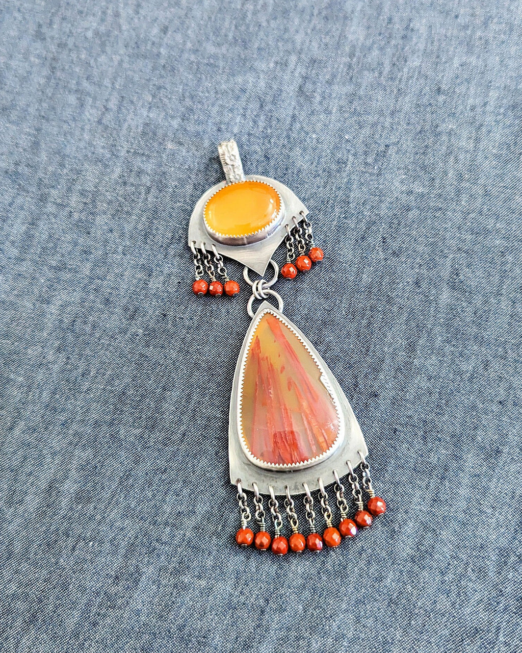 Red jasper bead fringe beneath earthy agate stone