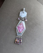 Rustic ruby pendant with visible concentric crystal structure