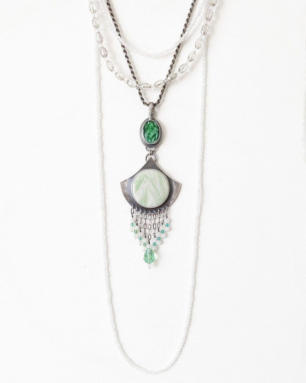 Necklace with green pendant on a white background