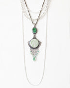 Necklace with green pendant on a white background