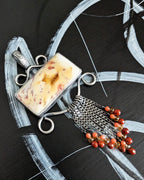 Close up of druzy agate stone and bead fringe details