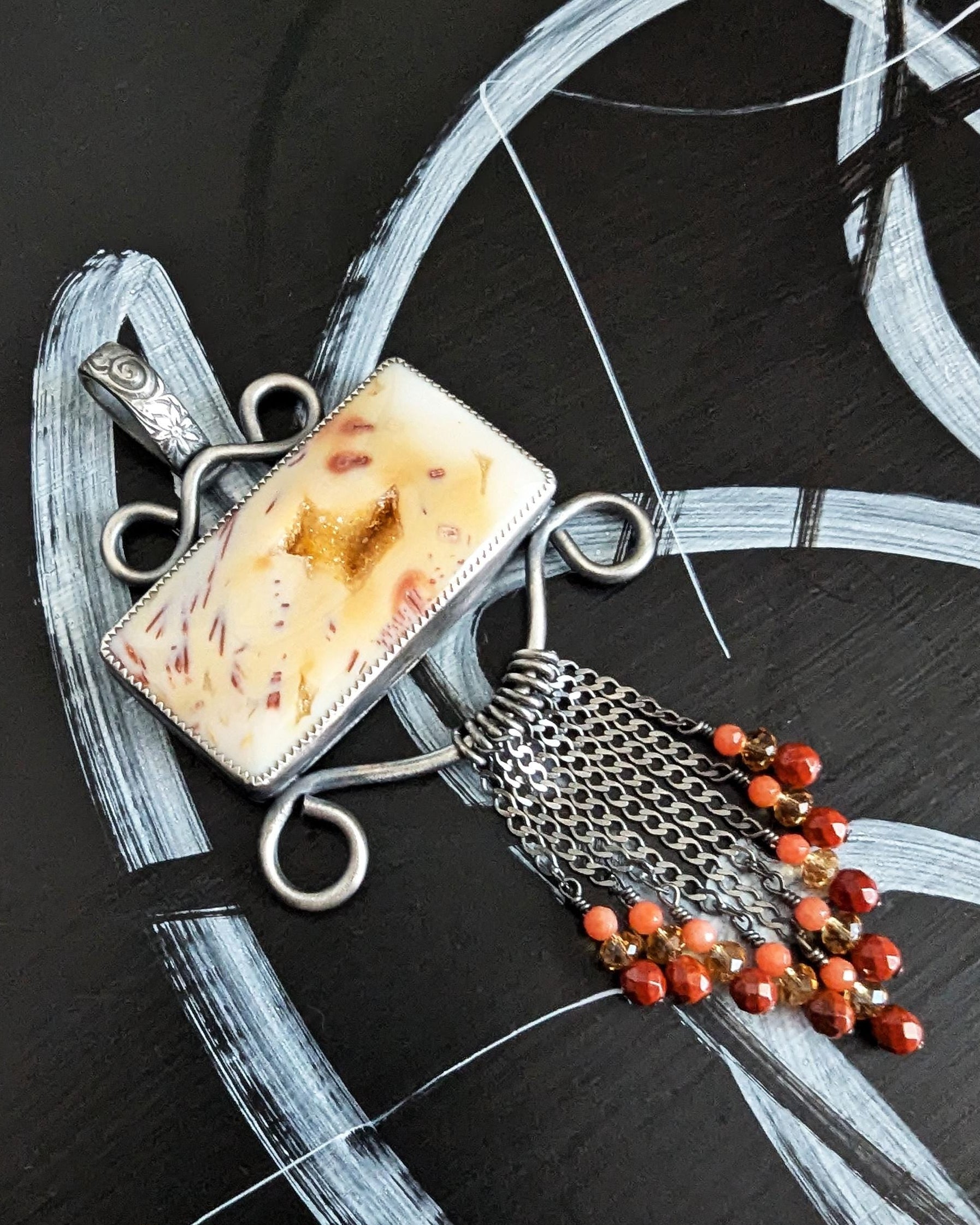 Close up of druzy agate stone and bead fringe details
