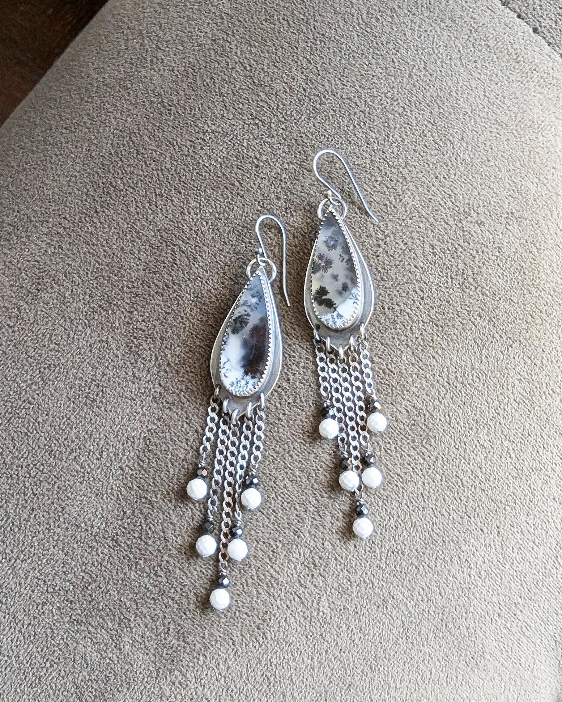 Teardrop dendritic opal stones with black branch-like inclusions
