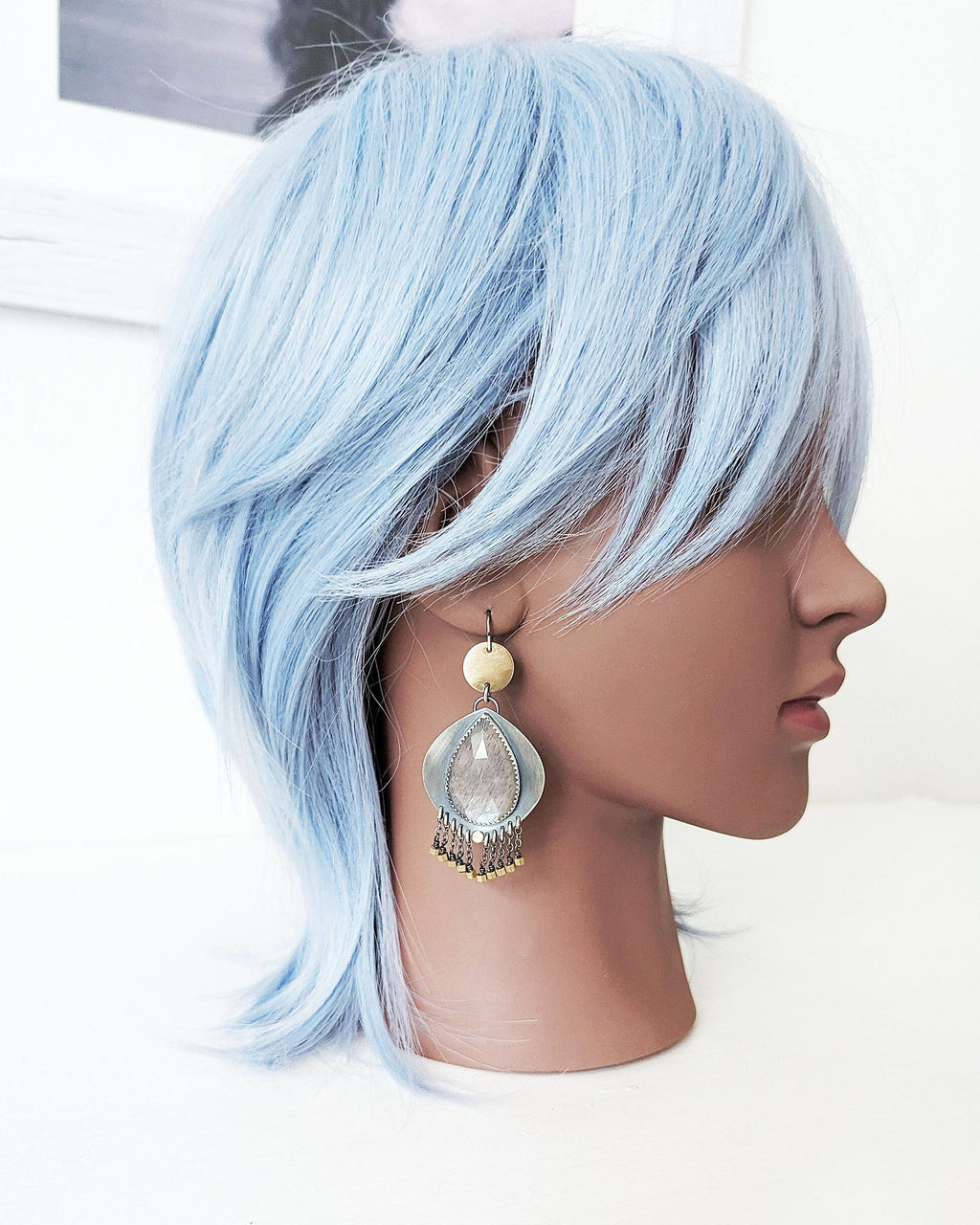 One of a kind grey moonstone statement earrings by Rebellenhaus on mannequin for scale