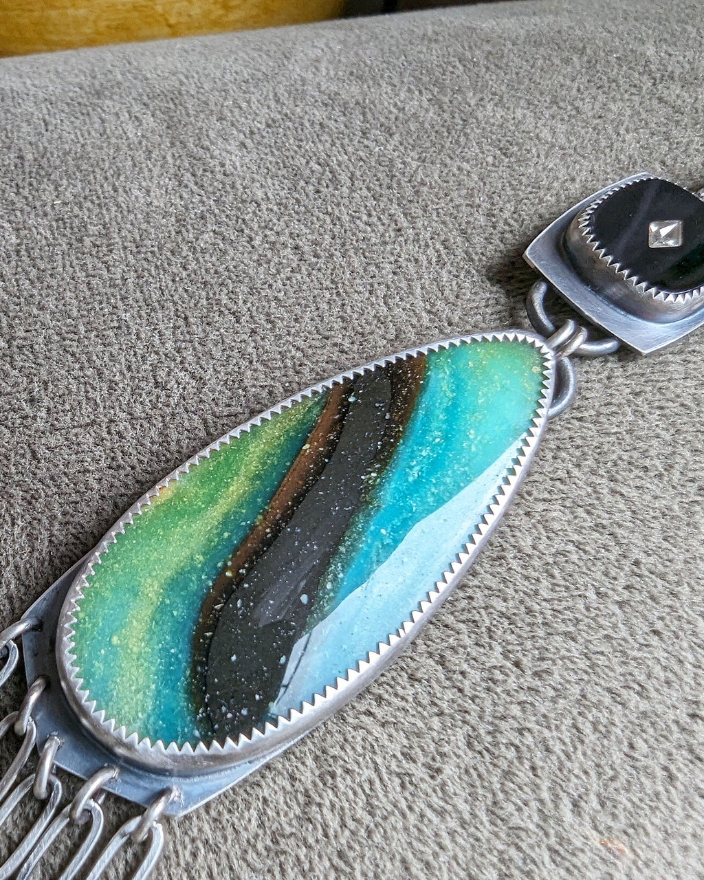 Opalized wood close up in oxidized sterling silver