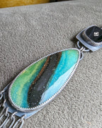 Opalized wood close up in oxidized sterling silver