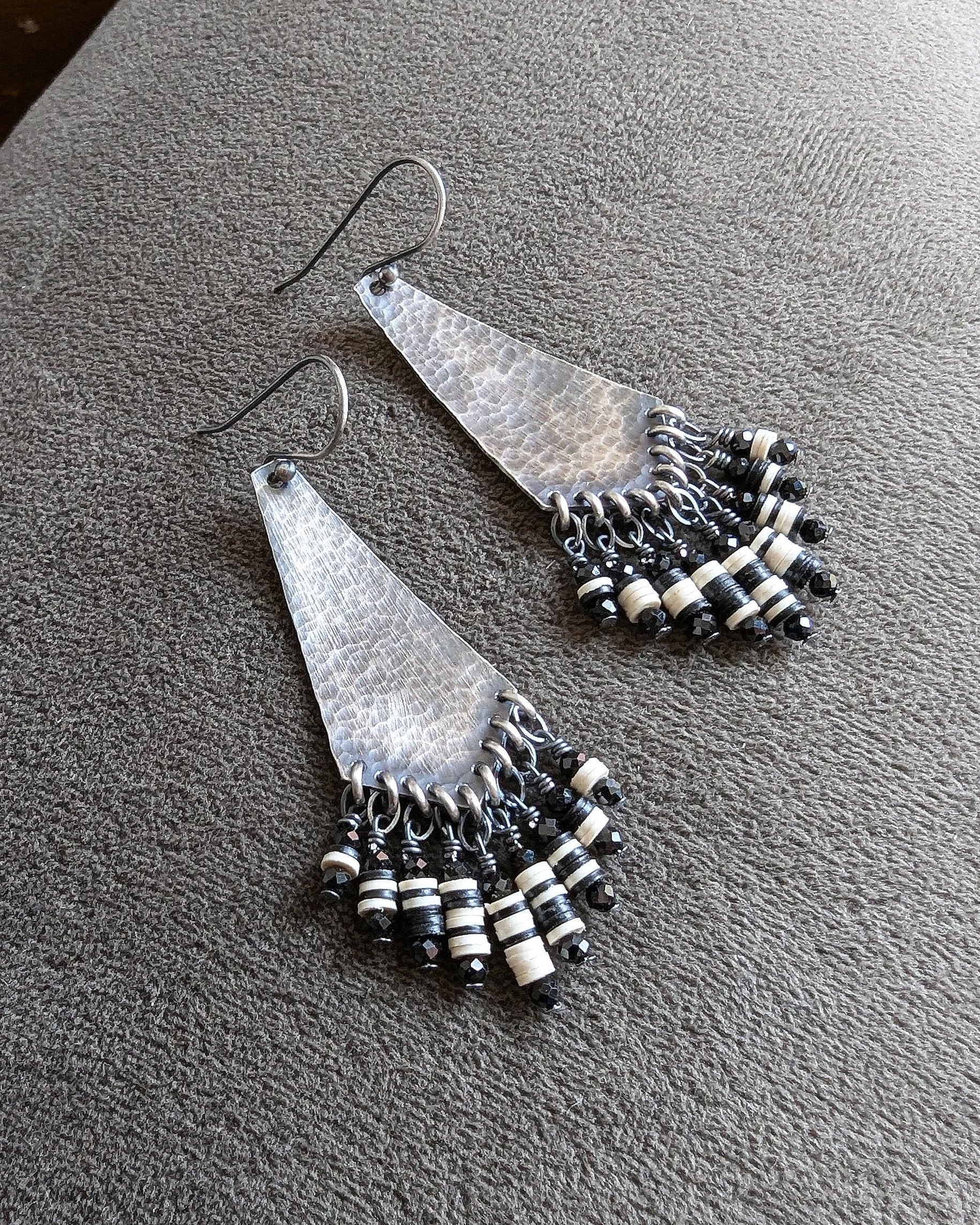 Arrow-shaped oxidized sterling silver earrings with hammered texture