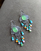 Multicolor crystal bead fringe beneath bright chalcedony stone