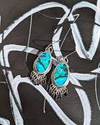 Teal and green gemstone dangle earrings with black spinel fringe