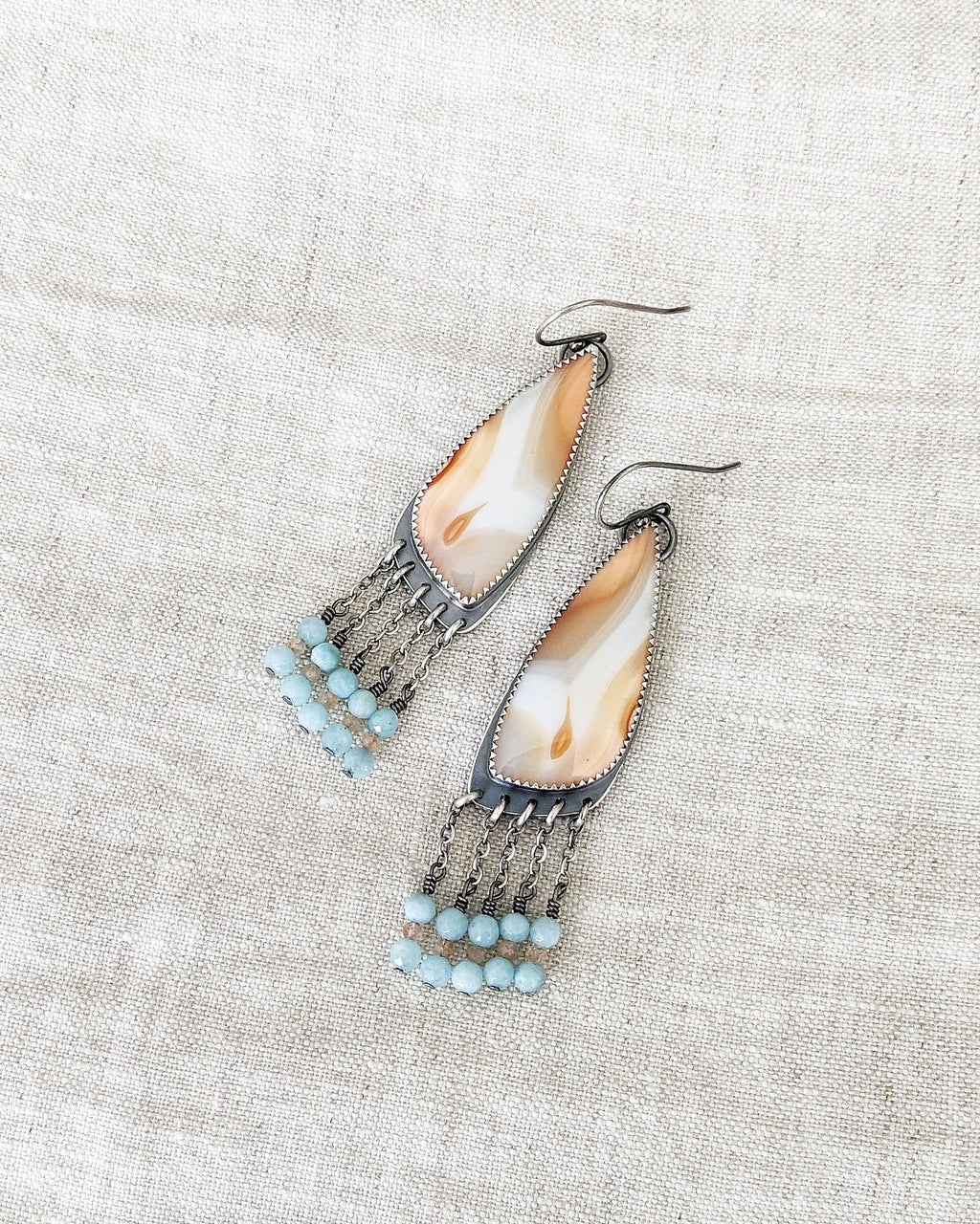 Feminine boho earrings featuring orange white agate stones