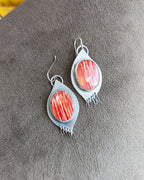 Natural shell statement earrings with warm sunset-inspired hues