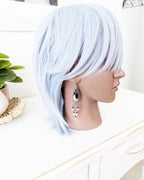 Artisan sterling silver earrings featuring dendritic opal and spinel shown on mannequin for scale
