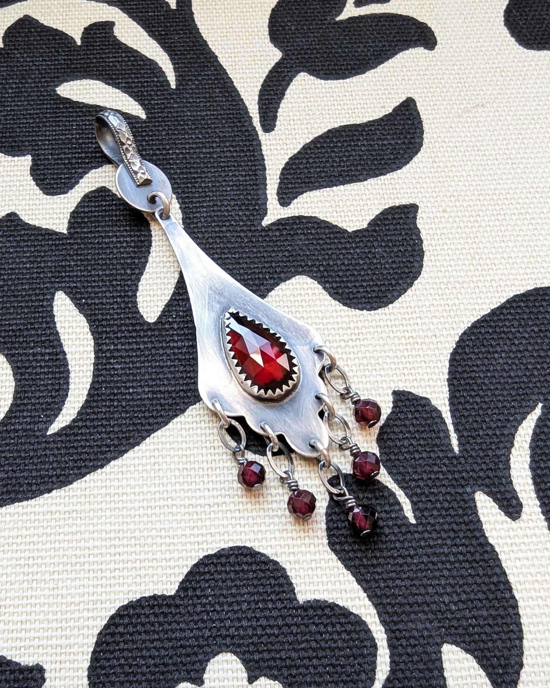Art Nouveau inspired sterling silver necklace with garnet center