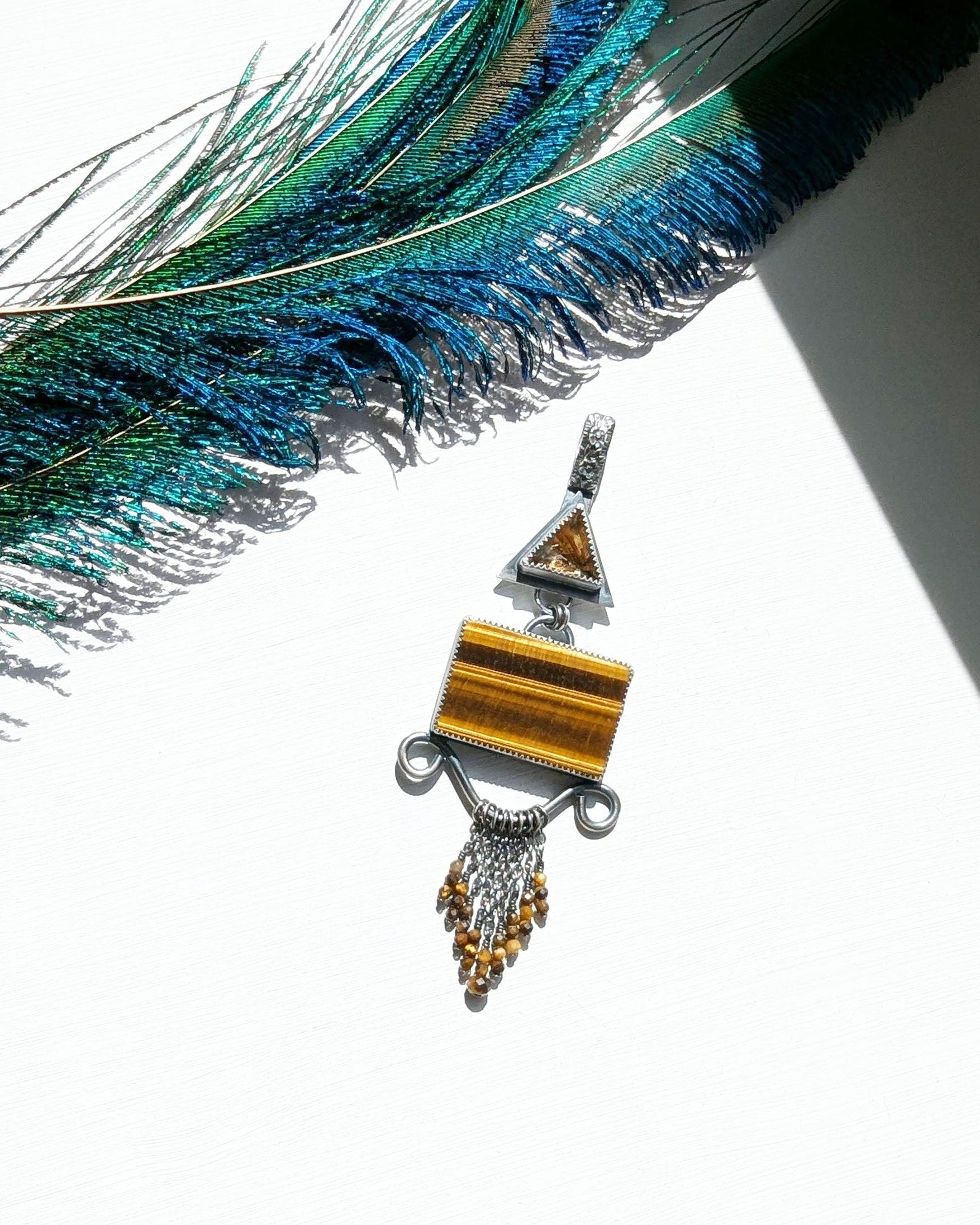 Star rutile quartz and tiger’s eye pendant in oxidized sterling silver filigree