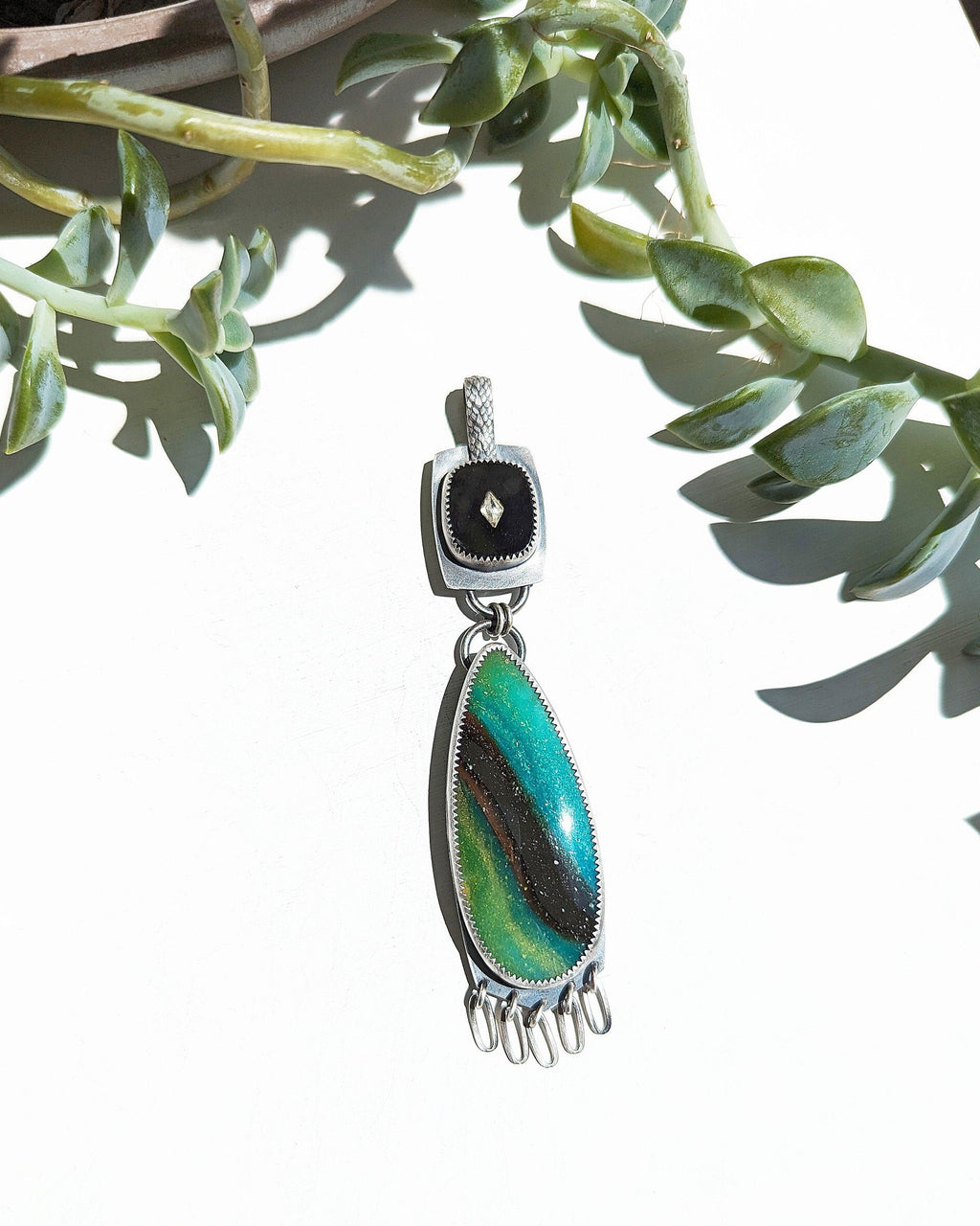 Opalized wood pendant with vintage black glass