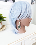 Large olive green gemstone statement earrings on mannequin for scale