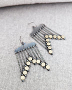 Bold black and gold statement earrings with hammered texture