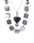 Sparkling blue goldstone pendant with beaded fringe movement shown with layering necklace and on chain (not included)