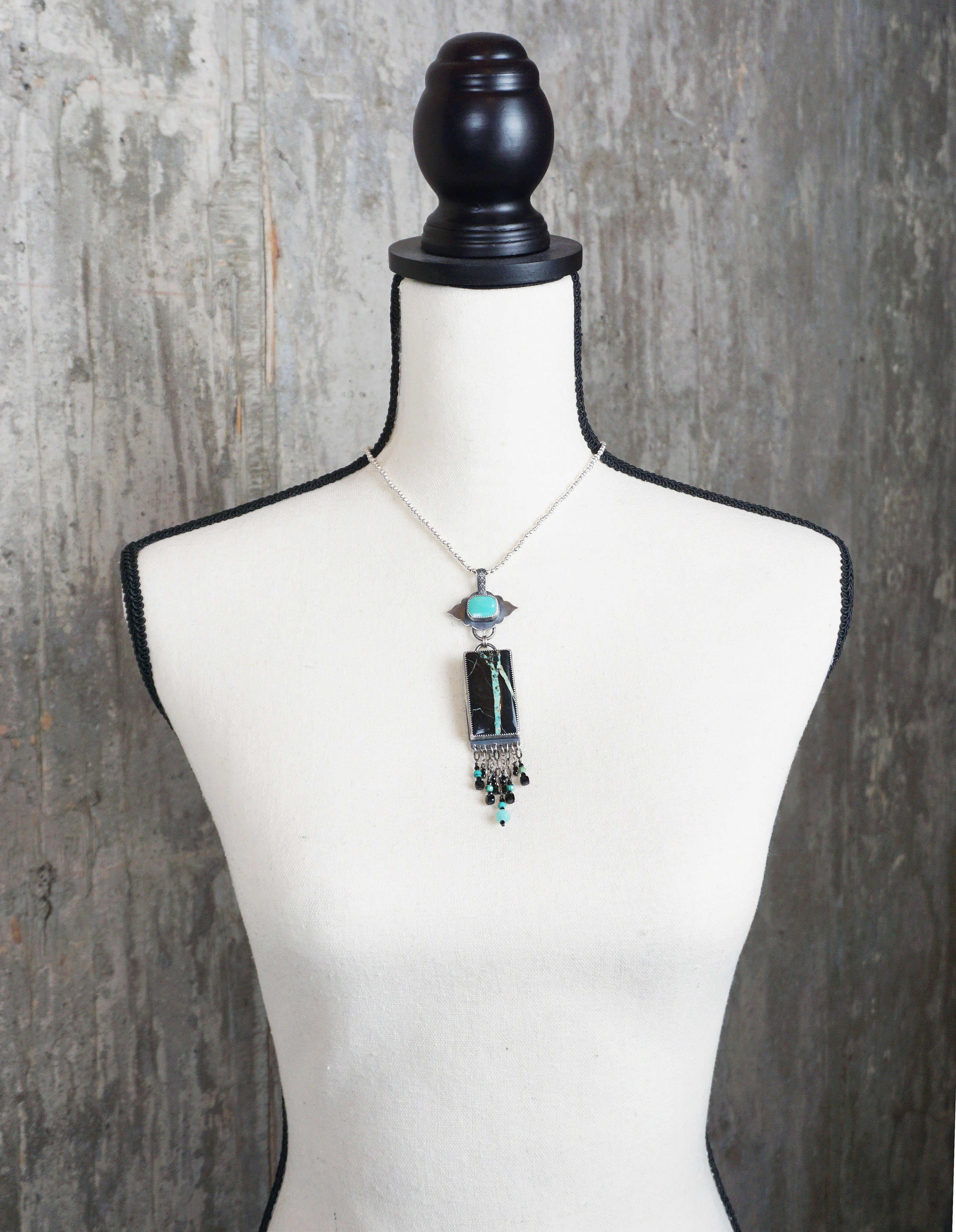 large turquoise statement necklace with oxidized sterling silver on bust for scale