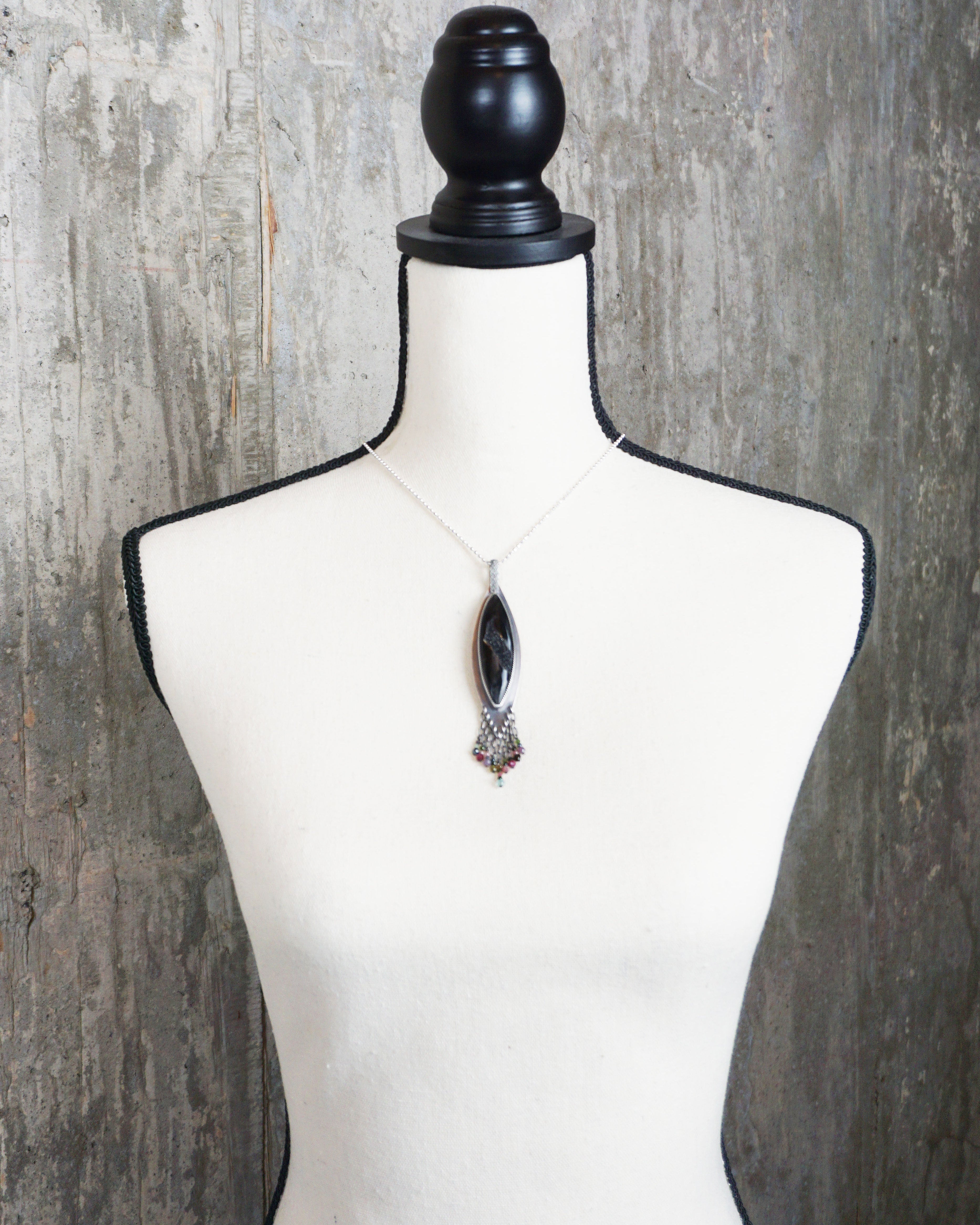 unique statement necklace with black agate druzy and fringe on bust and chain for scale (chain not included)