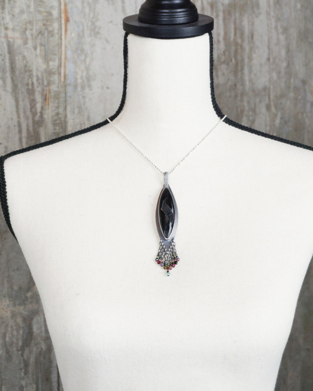 dark gemstone necklace with black agate and colorful bead fringe on bust for scale (chain not included)