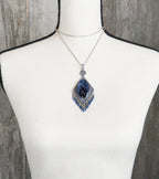 artisan silver pendant with diamond shape and beaded fringe on bust for scale (chain not included)