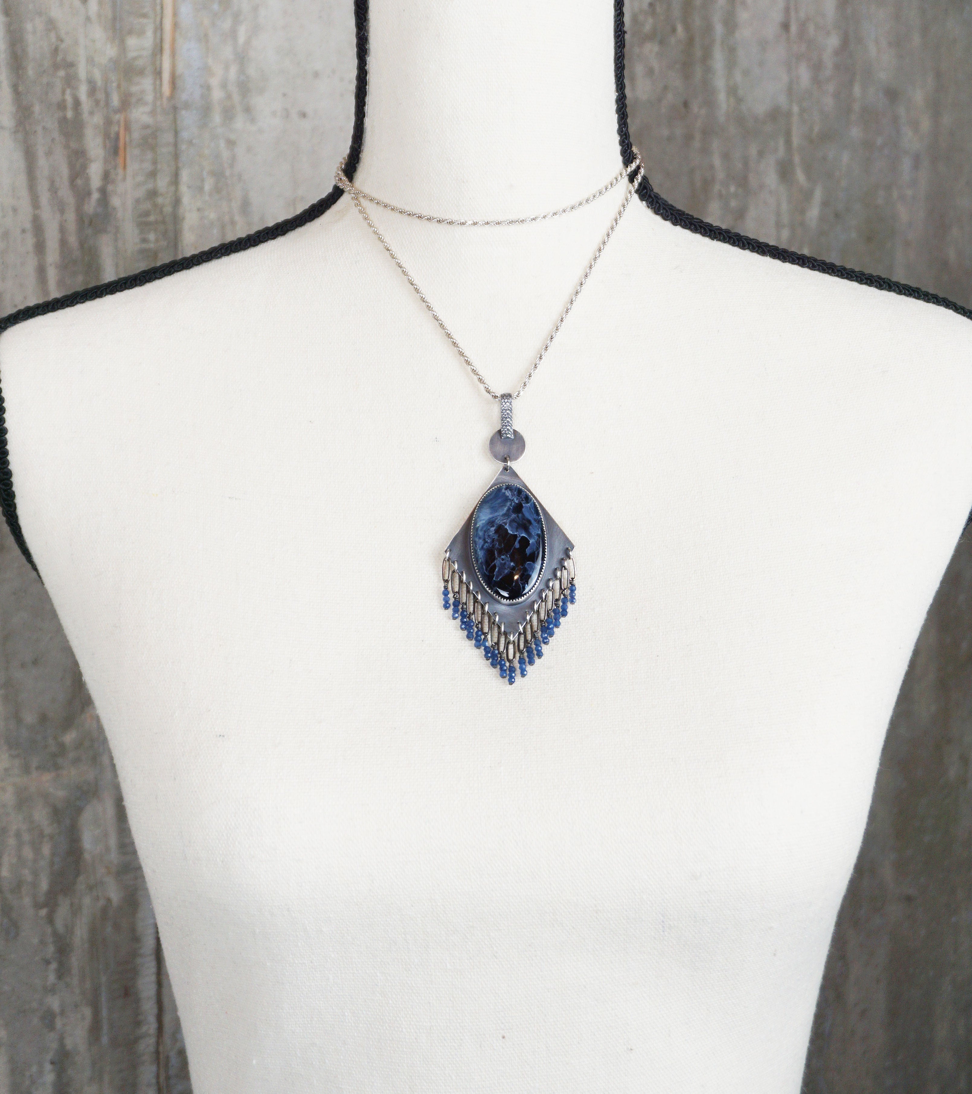 artisan silver pendant with diamond shape and beaded fringe on bust for scale (chain not included)