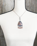 bold oxidized silver pendant with natural patterned stone on bust for scale (chain not included)