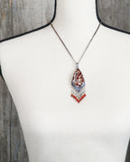 artisan gemstone pendant with mother of pearl and zircon beads on bust for scale (chain not included)