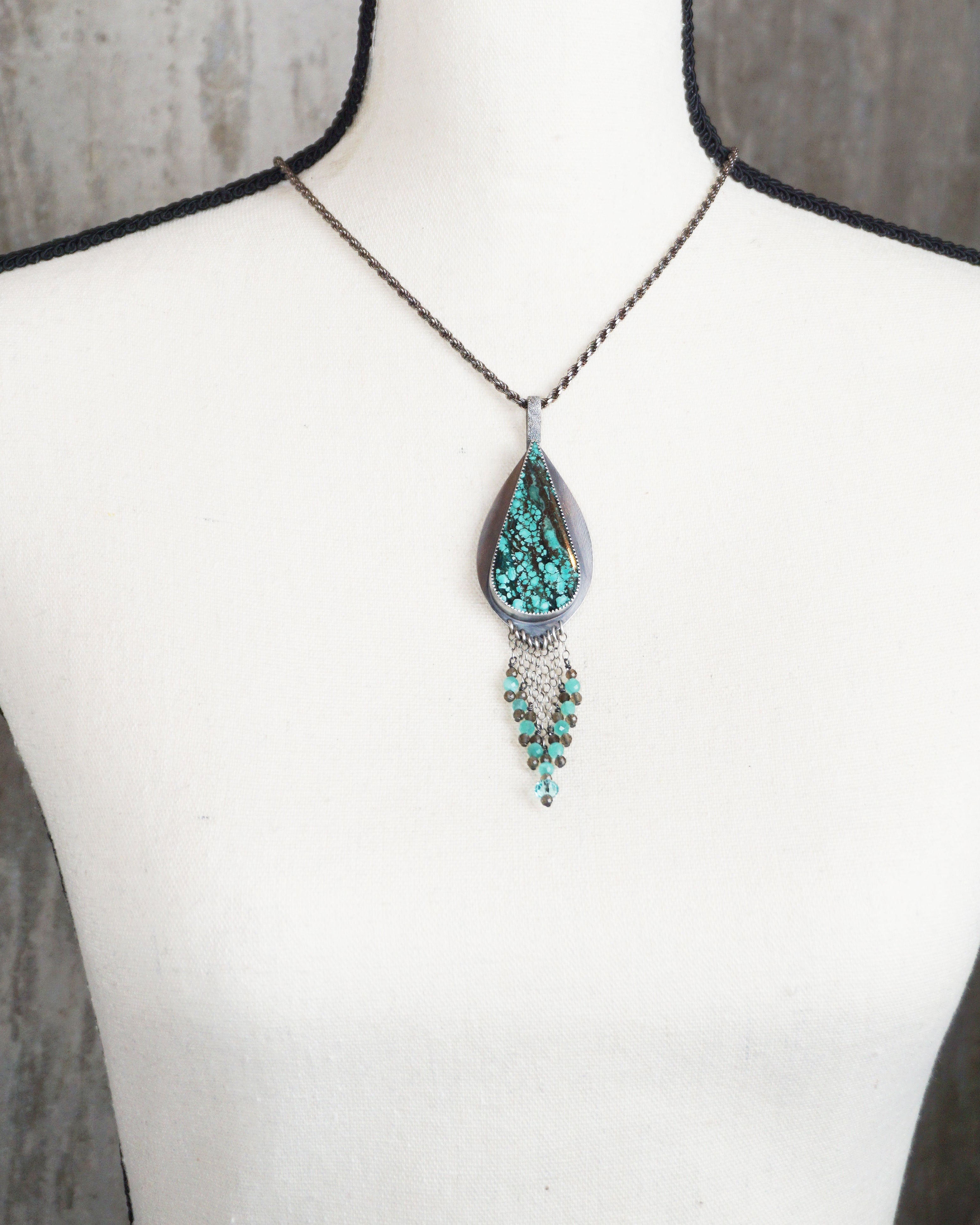 bold turquoise necklace with v shaped beaded fringe on bust for scale (chain not included)