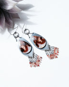 romantic statement earrings with red and white gemstone tones