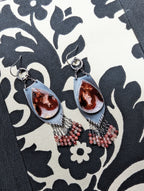 long chandelier earrings with layered pink and red fringe
