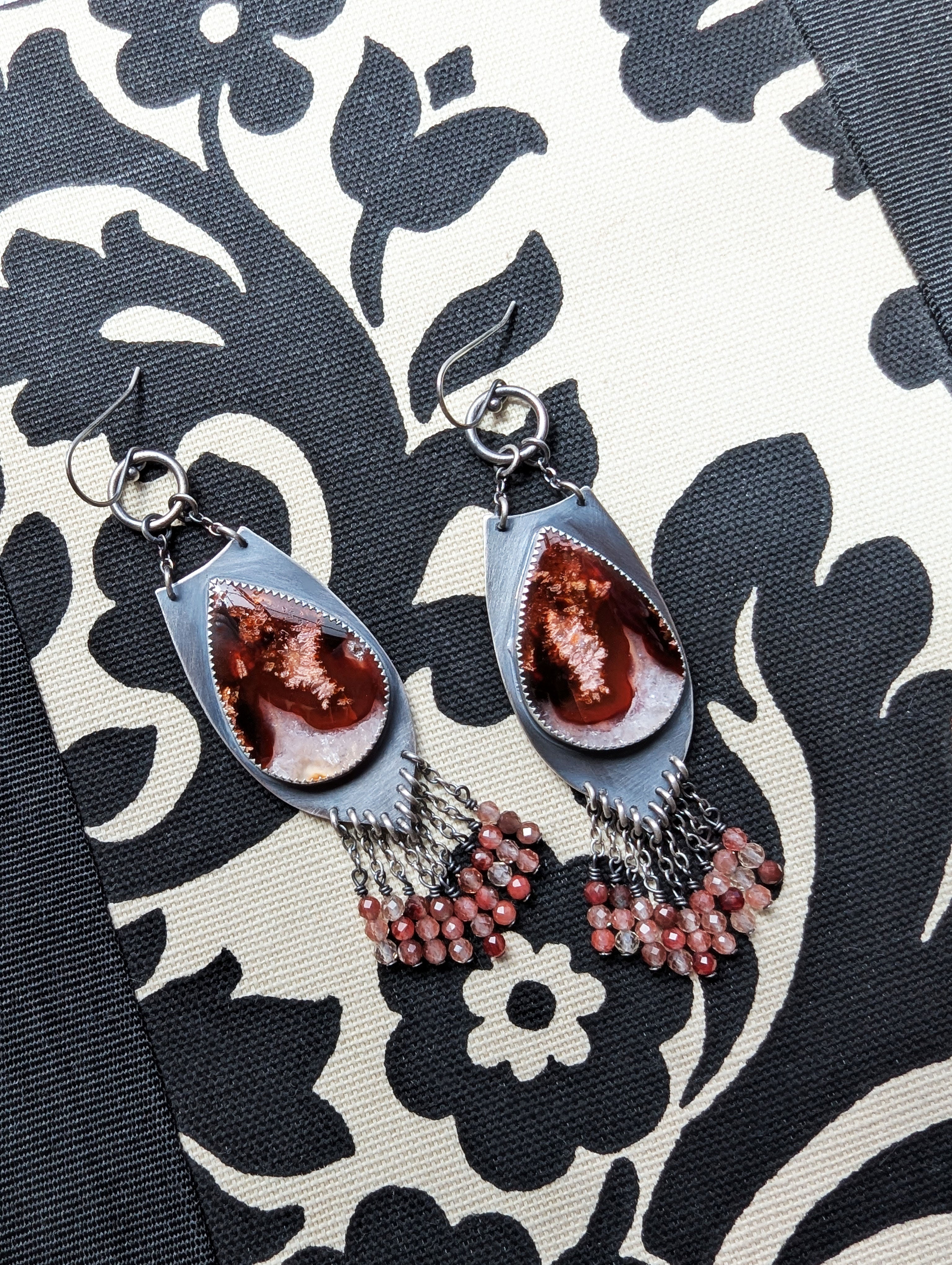 long chandelier earrings with layered pink and red fringe