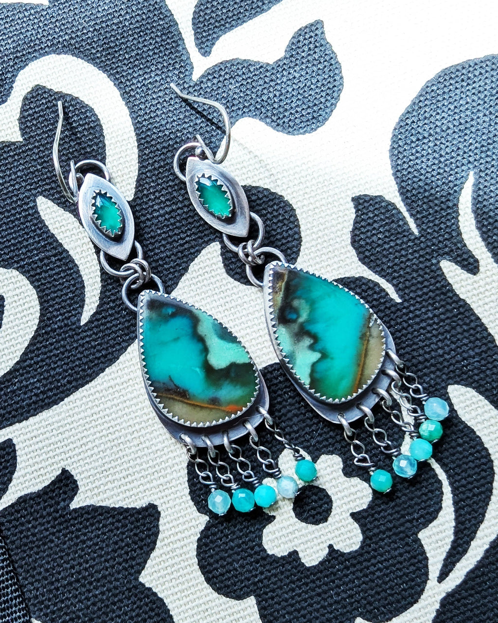 asymmetrical opal wood earrings with bright green onyx drops