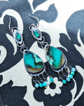 asymmetrical opal wood earrings with bright green onyx drops