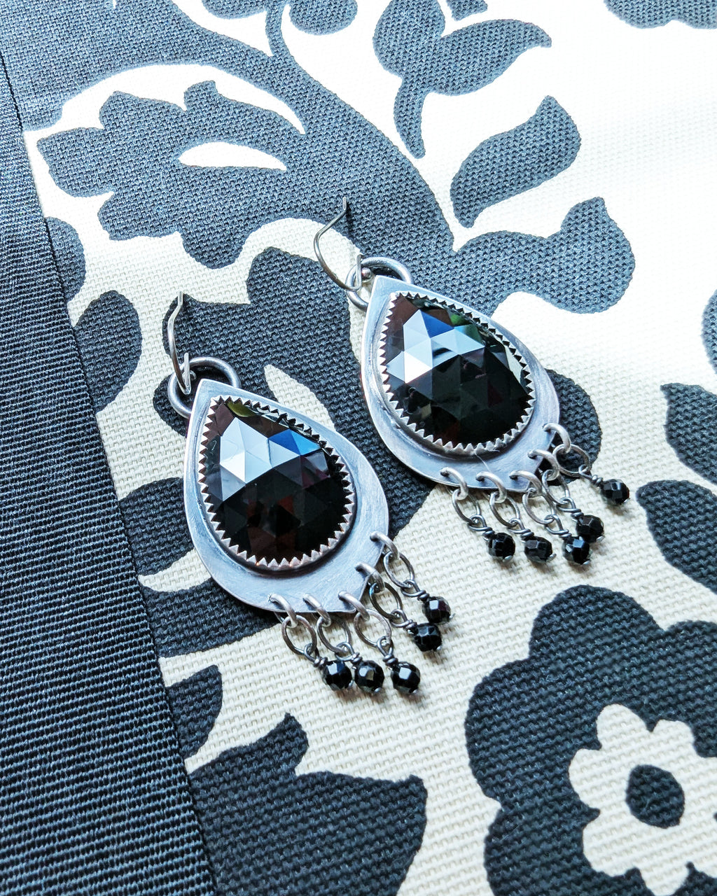 rose cut black spinel earrings with leaf link fringe detail