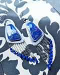 large blue gemstone earrings with asymmetrical silver triangle design