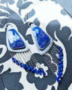 large blue gemstone earrings with asymmetrical silver triangle design