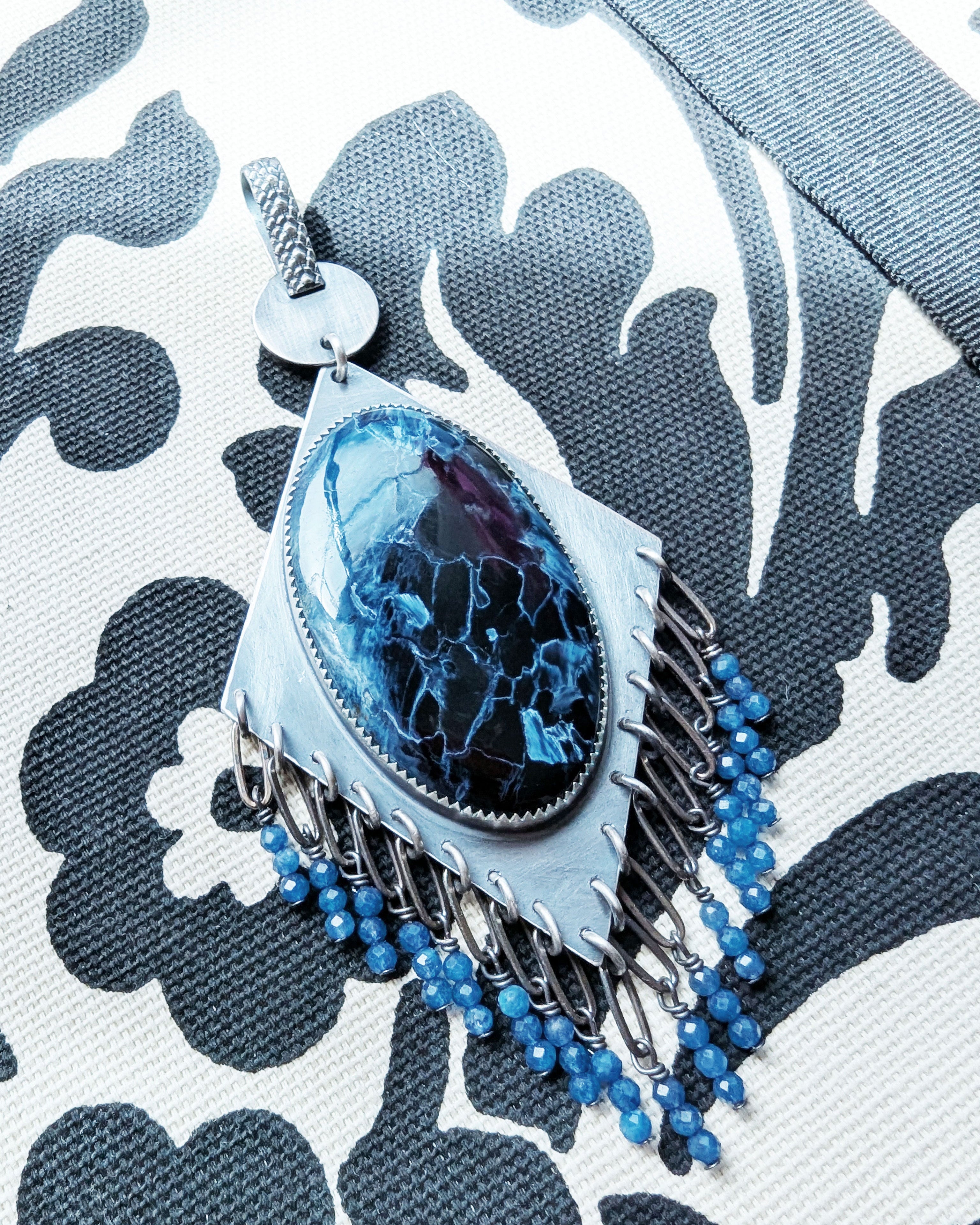 blue gemstone necklace with iridescent pietersite stone