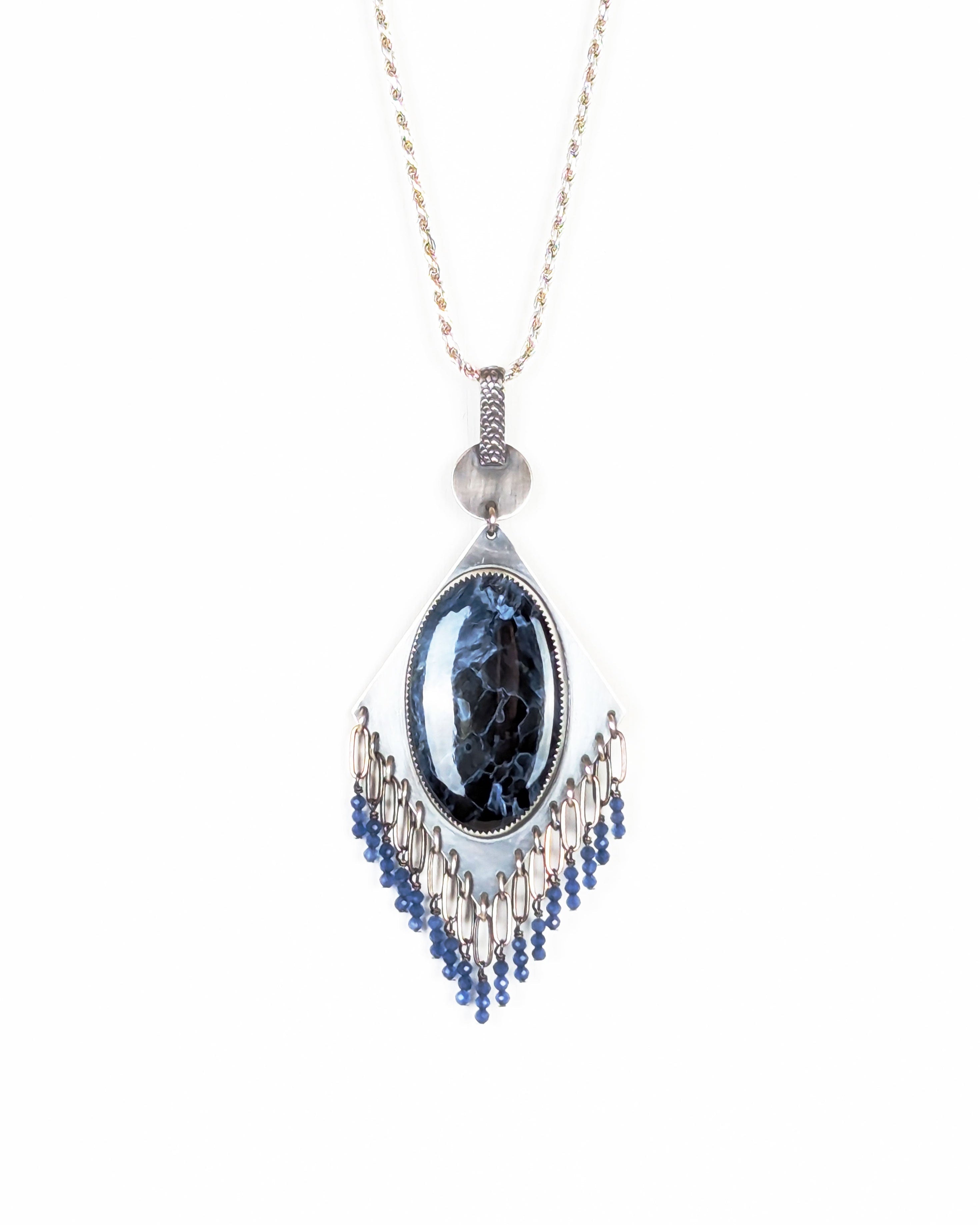 handcrafted oxidized silver pendant with shimmering blue stone on chain (not included)